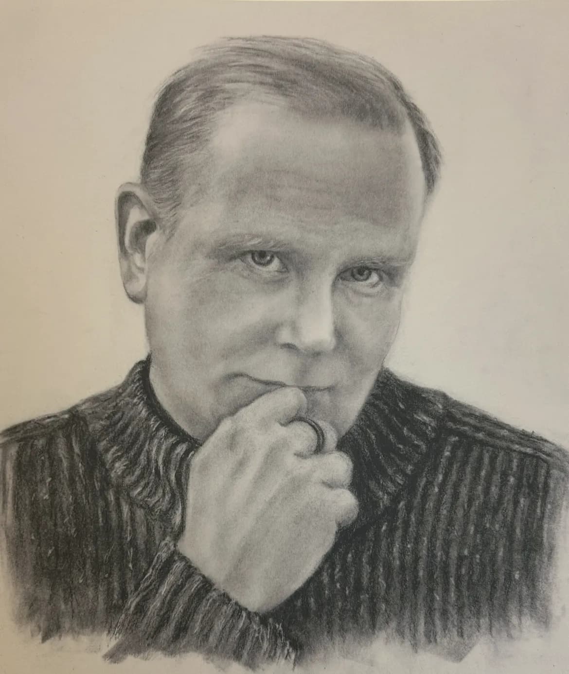 Pencil drawing of Jamie Parsley in a ribbed sweater, chin resting on his hand